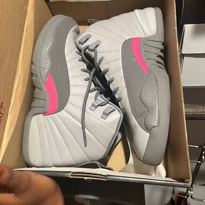 Grey and pink Jordan 12s